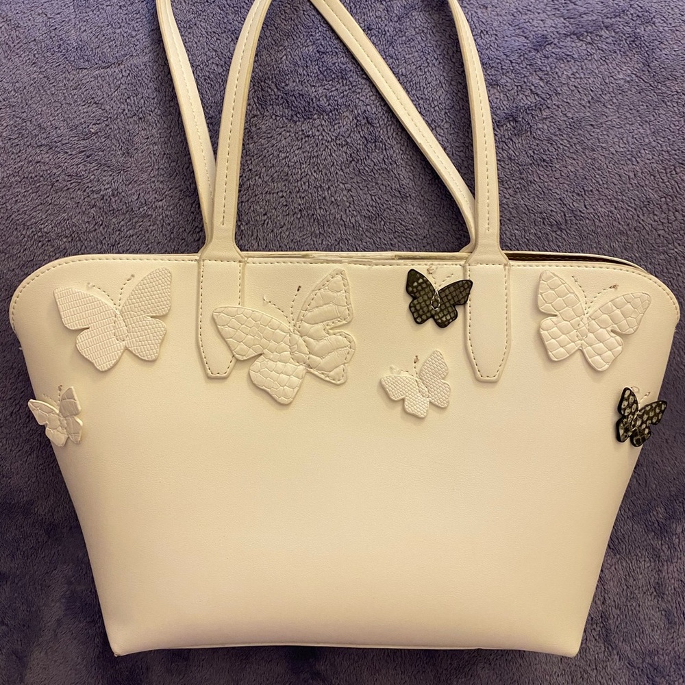 Tote bag in White with butterfly appliqué.